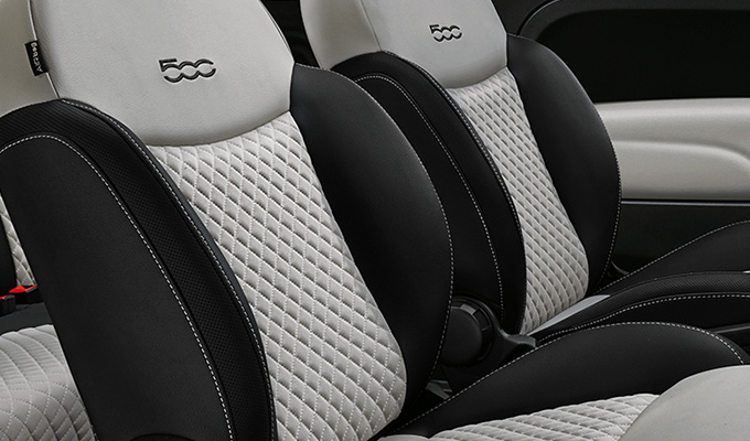 Dedicated black sand Matelassé fabric seats with techno leather details